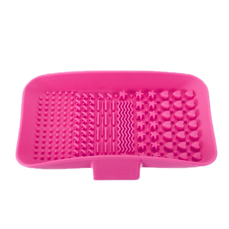 Pink silicone textured soap holder with drainage slots and various massage patterns