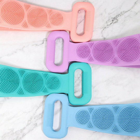 Four silicone body brush belts in pink, purple, teal, and blue