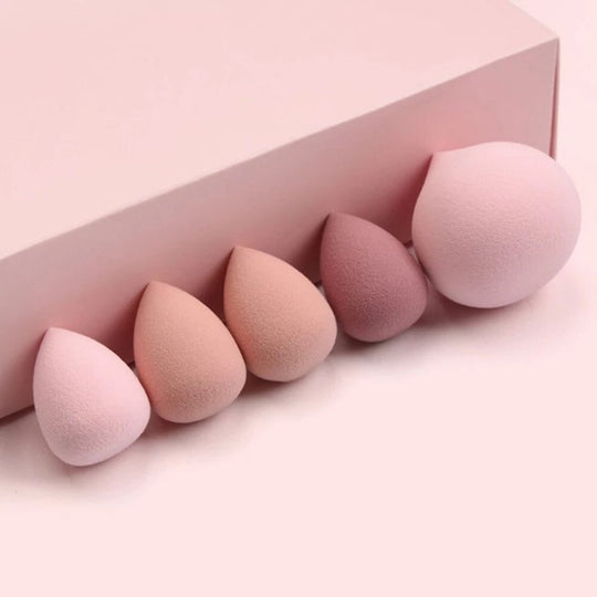 Set of five teardrop-shaped makeup sponges in varying shades of pink