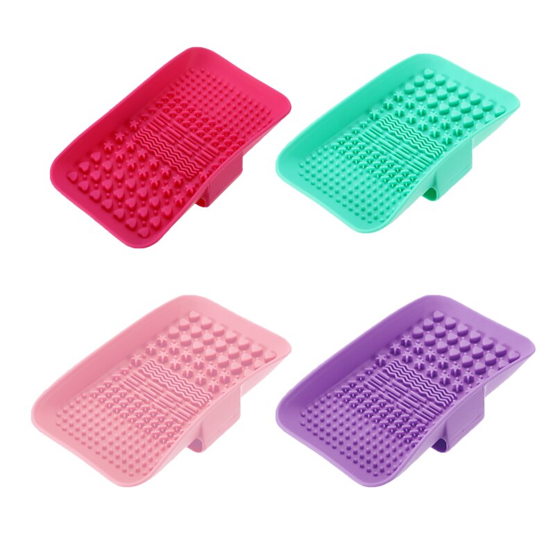 Four colorful silicone foot scrubbers in red, teal, pink, and purple.