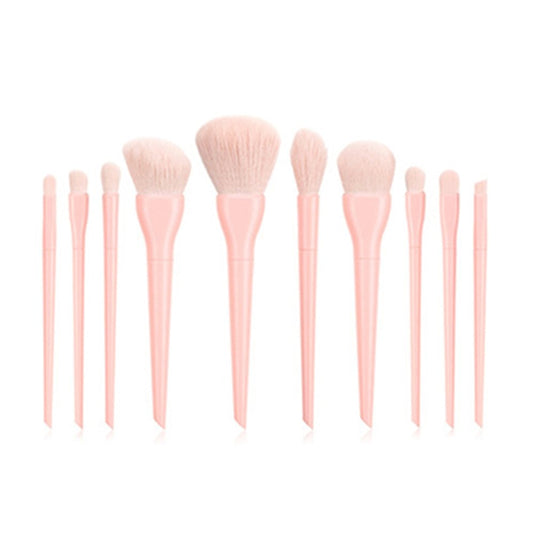 Set of 12 professional makeup brushes with light pink handles and soft bristles.