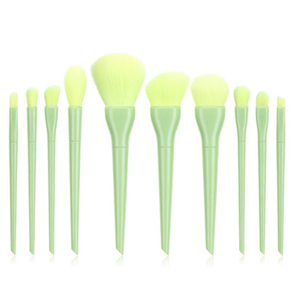 Set of 12 light green makeup brushes for face and eye application on a white background.