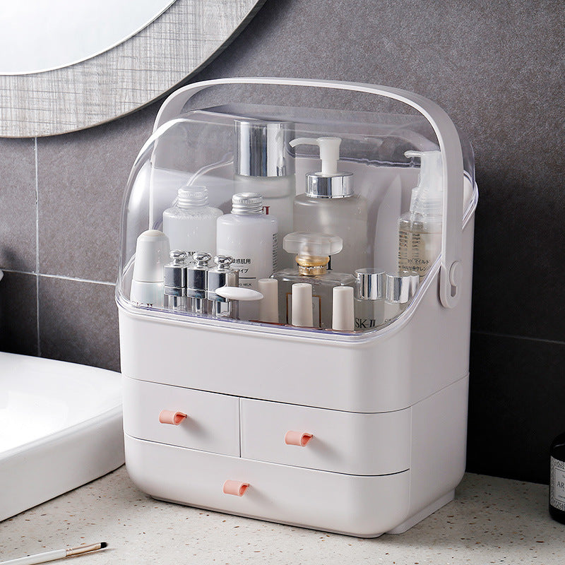 White plastic skincare organizer with transparent lid and small storage drawers on a bathroom counter