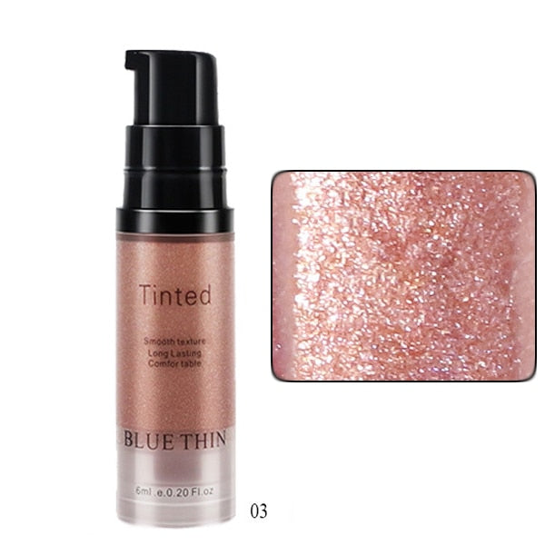 Blue Thin Tinted rose gold shimmering liquid highlighter bottle and swatch.