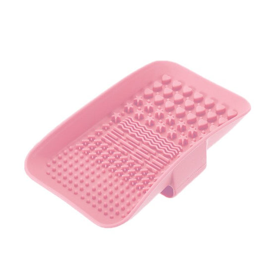 Pink textured silicone soap dish with heart-shaped drainage patterns