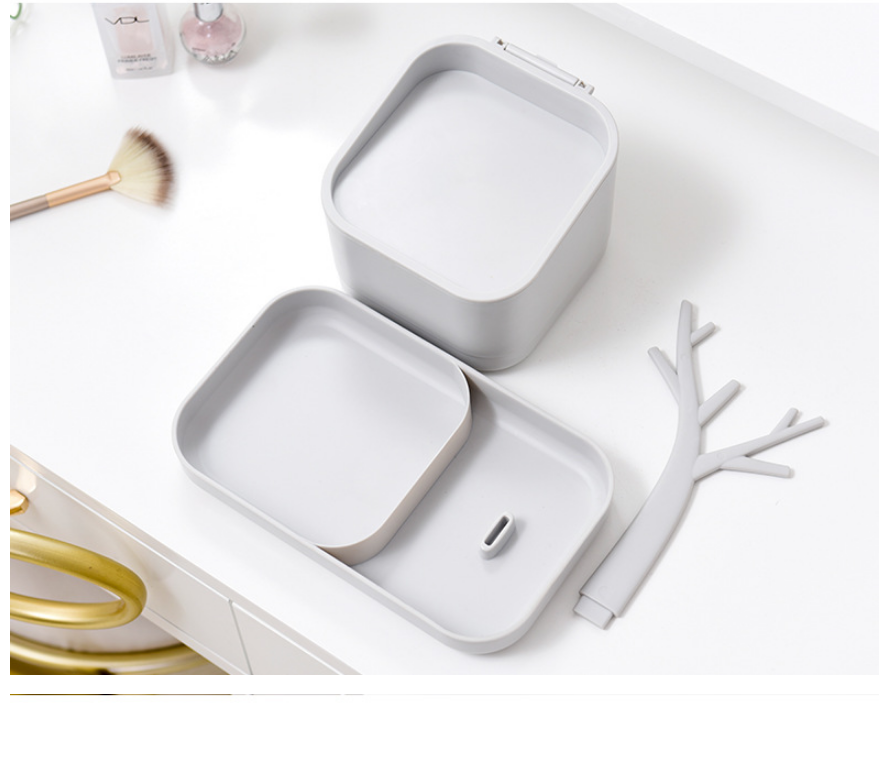 White square makeup brush organizer with removable divider and antler-shaped tool