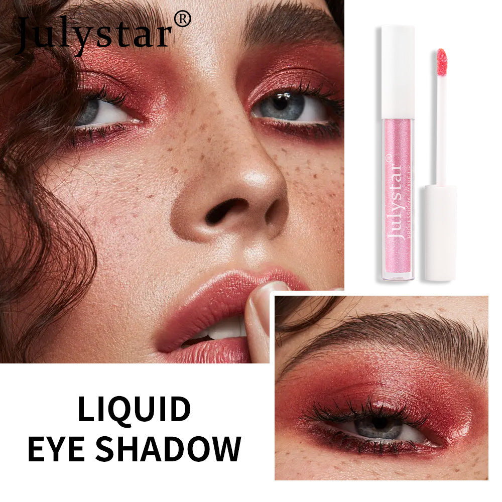 Julystar liquid eye shadow in shimmering red applied to a model's eyelids.