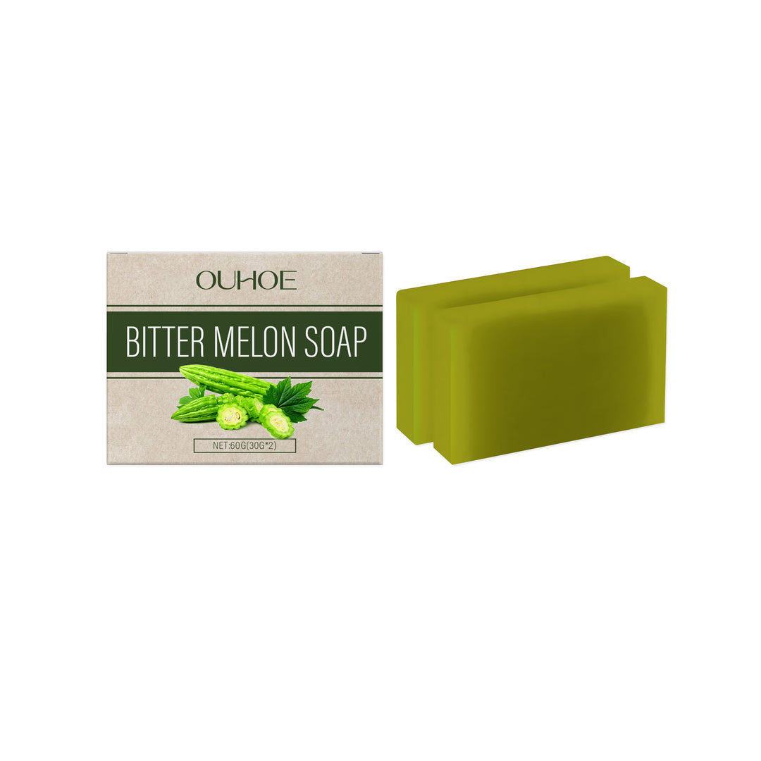 Two green bitter melon soap bars and product box